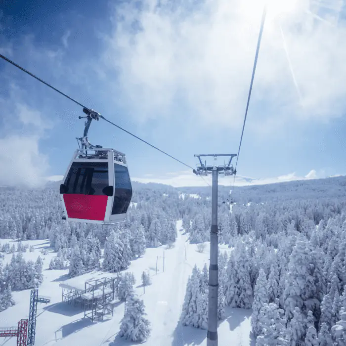Gondola cabin over snowy forest, symbolizing a journey toward detox and recovery