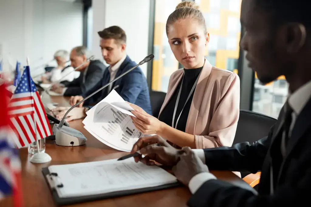business professionals at meeting discussing chart 2026 09 21 18 22 12 utc