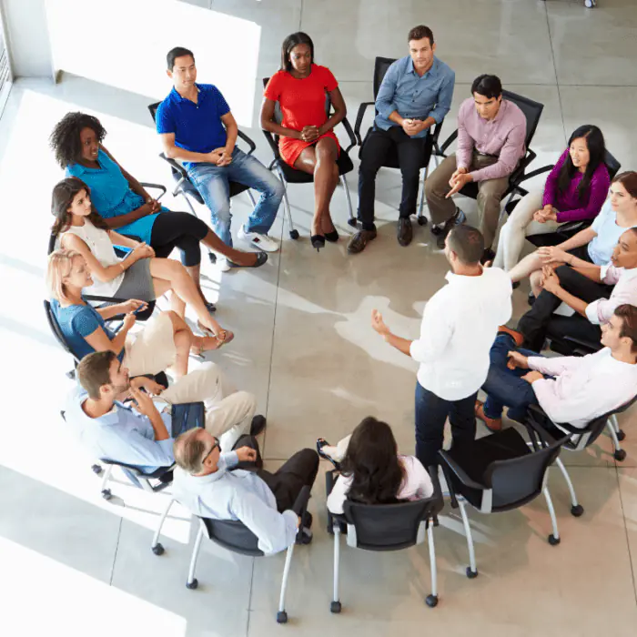 Facilitator leading a circular detox support group session